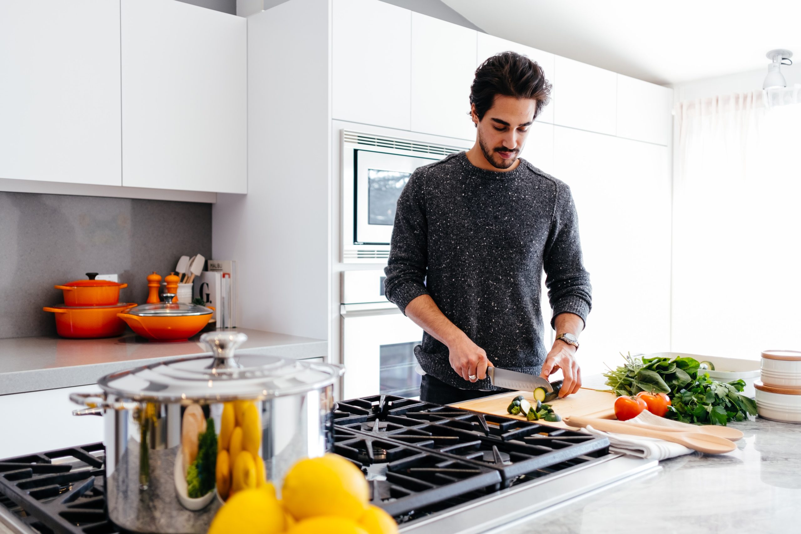 Guy in kitchen cooking on date: A guy who can cook is sexy to a woman and if you mention cooking in your online Bumble dating profile, you will make a woman laugh because it is a funny profile summary