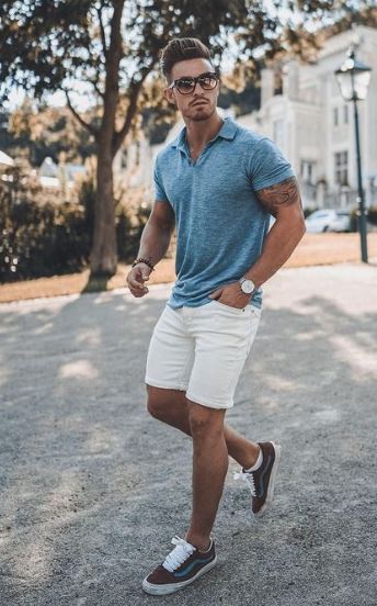 sexy guy dressed in shorts and a blue collared shirt for a summer first date