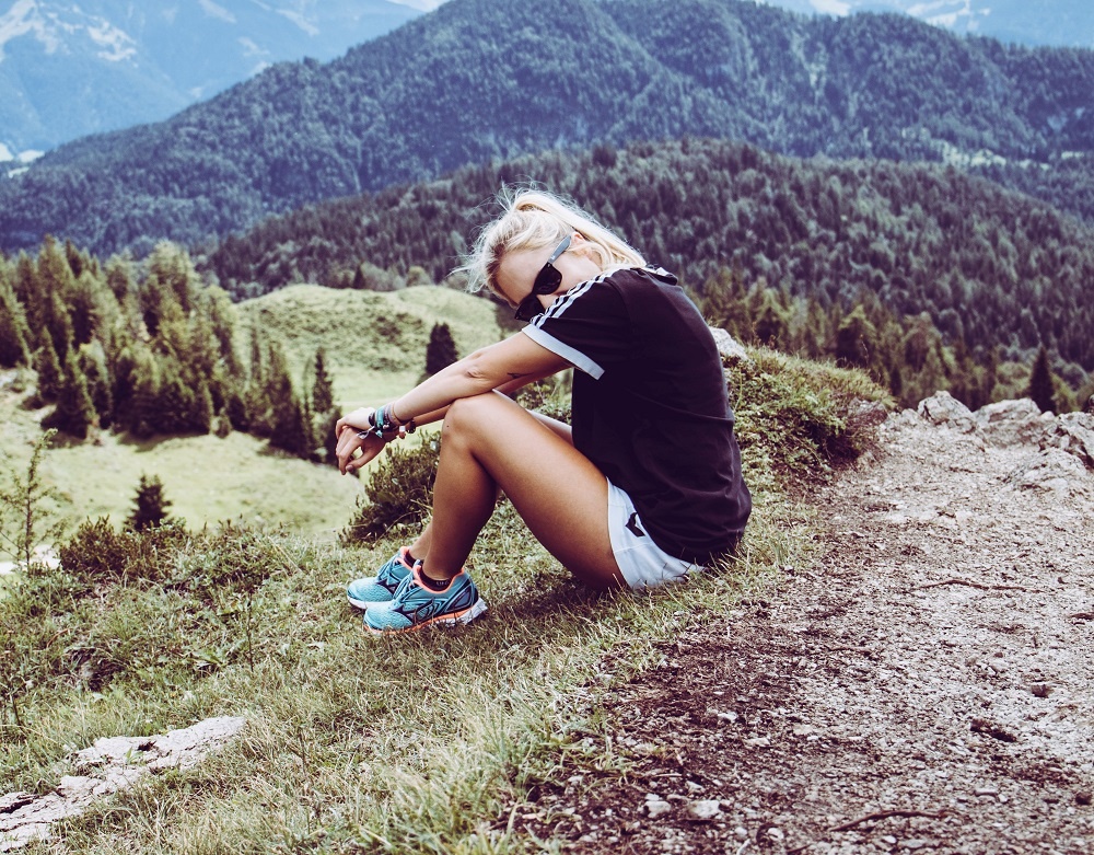 girl on a hike as an example of what to wear on a hike for a date for girls and a hiking date outfit by Dating Snippets